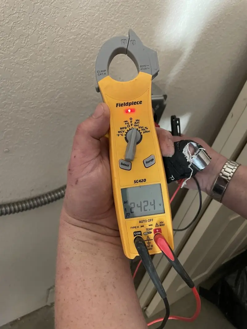 Voltage testing with clamp meter during Outlet Installation in Cedarburg